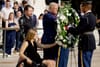 Trump lays a wreath alongside two Marines injured during Abbey Gate. (Photo by Anna Moneymaker/Getty Images)