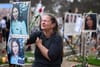 A woman breaks down at the memorial to Yulia Waxer Daunov. (Photo by Leon Neal/Getty Images)