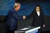 Trump and Harris shake hands before their first debate. Photo by SAUL LOEB / AFP