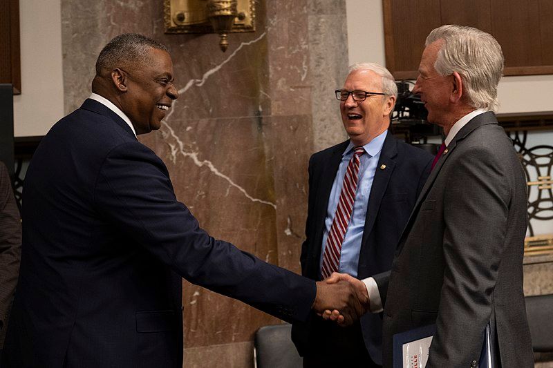 Secretary of Defense Lloyd Austin (left) greeting Sen. Tommy Tuberville (right) in 2022. Image U.S. Secretary of Defense