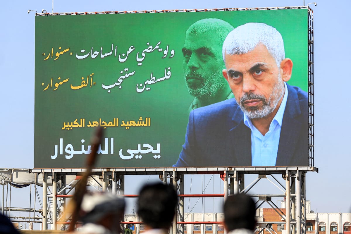 A billboard depicting Hamas' slain leader Yahya Sinwar. (Photo by MOHAMMED HUWAIS/AFP via Getty Images)