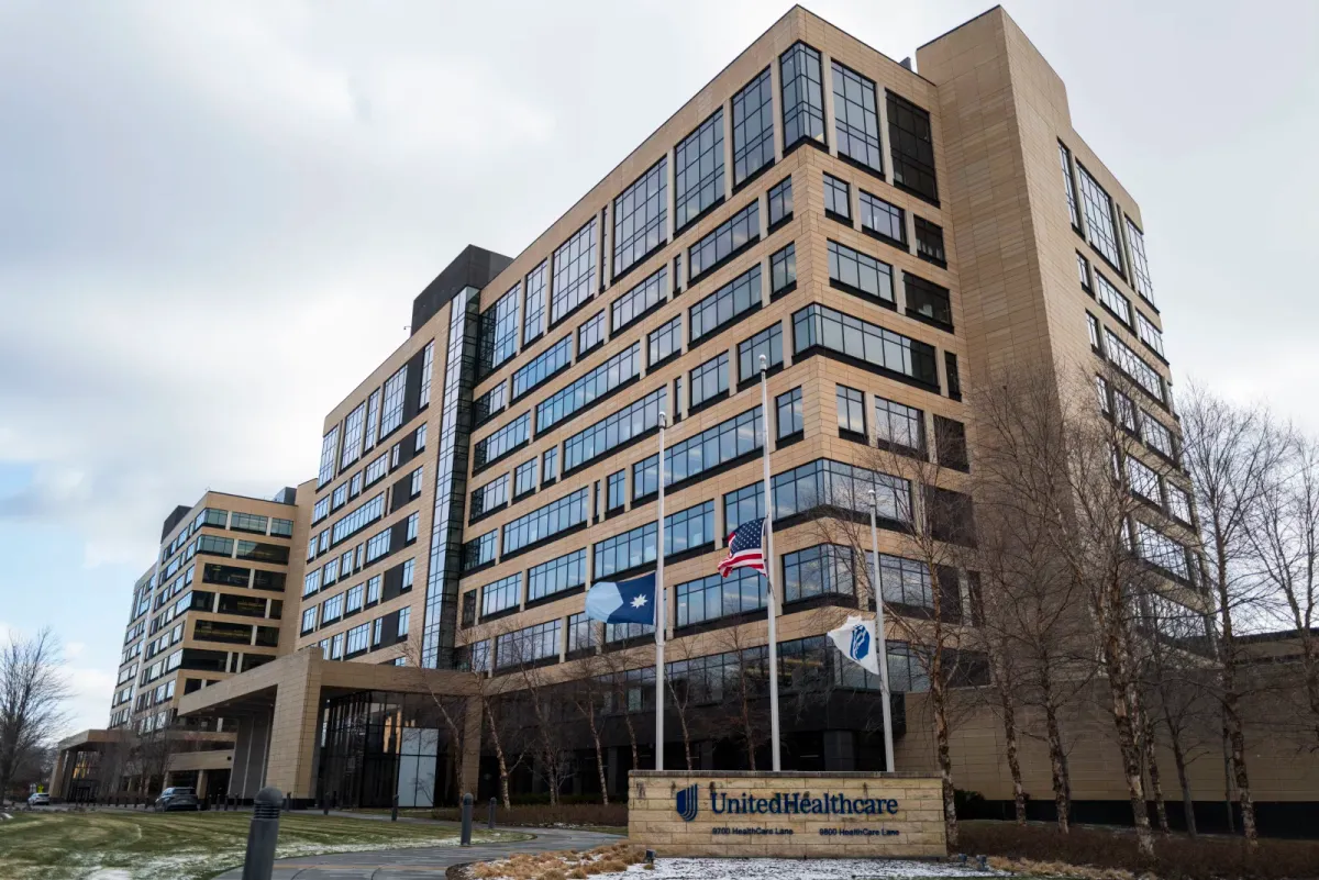 Flags fly at half mast outside the United Healthcare corporate headquarters in Minnetonka, Minnesota on Wednesday.