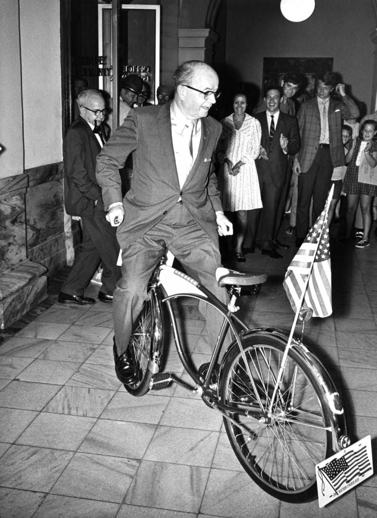 Georgia Governor Lester Maddox pedals a bicycle backwards | Georgia State University Library, Atlanta Journal-Constitution