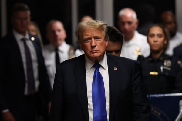 Former U.S. President Donald Trump walks out of the courtroom. Photo by Michael M. Santiago/Getty Images