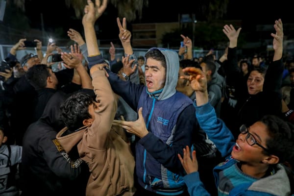 Gazans celebrate news of a ceasefire deal on January 15, 2025. (Photo by YOUSSEF ALZANOUN via Getty Images)